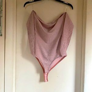 Pink sparkly open back bodysuit.